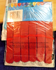 4 UNOPENED PACKS ONE 9 FT GARLAND WITH 6 TISSUE POM POMS IN EACH PACK RED & BLUE