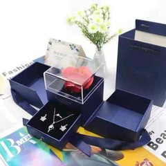 Exquisite eternal rose petals stored in acrylic flip jewelry box