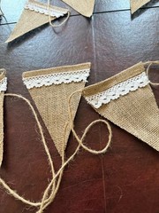 Party banner, stiff tan burlap with lace trim. Approximately 20 feet long