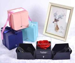 Exquisite eternal rose petals stored in acrylic flip jewelry box