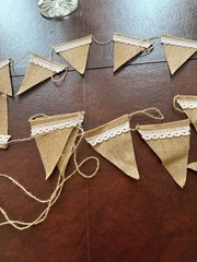 Party banner, stiff tan burlap with lace trim. Approximately 20 feet long