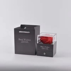 Exquisite eternal flower preserved in an acrylic jewelry box