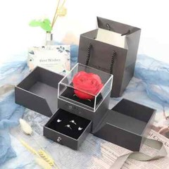 Exquisite eternal rose petals stored in acrylic flip jewelry box
