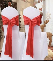 50 new/ 50 used universal black chair covers, 50 used red bow, 10 silver runners